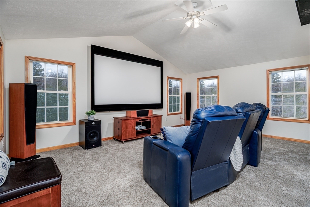 326 Matthews Street Gardner, MA 01440 - Photo 18 of 42 a living room with furniture and a flat screen tv