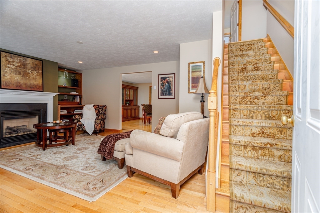326 Matthews Street Gardner, MA 01440 - Photo 19 of 42 a living room with furniture and a fireplace