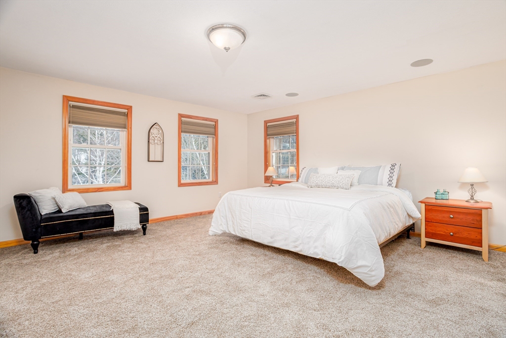 326 Matthews Street Gardner, MA 01440 - Photo 22 of 42 a bedroom with a bed and a couch