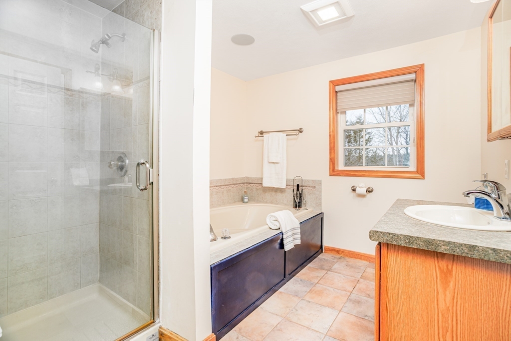 326 Matthews Street Gardner, MA 01440 - Photo 25 of 42 a bathroom with a tub sink shower and mirror