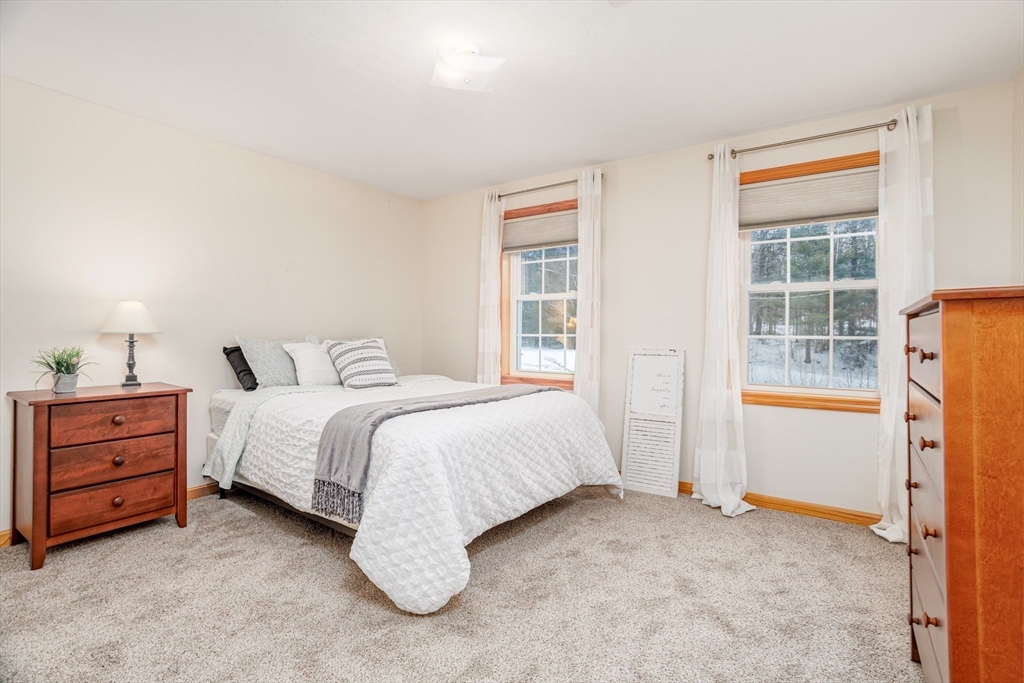 326 Matthews Street Gardner, MA 01440 - Photo 30 of 42 a spacious bedroom with a bed and a window