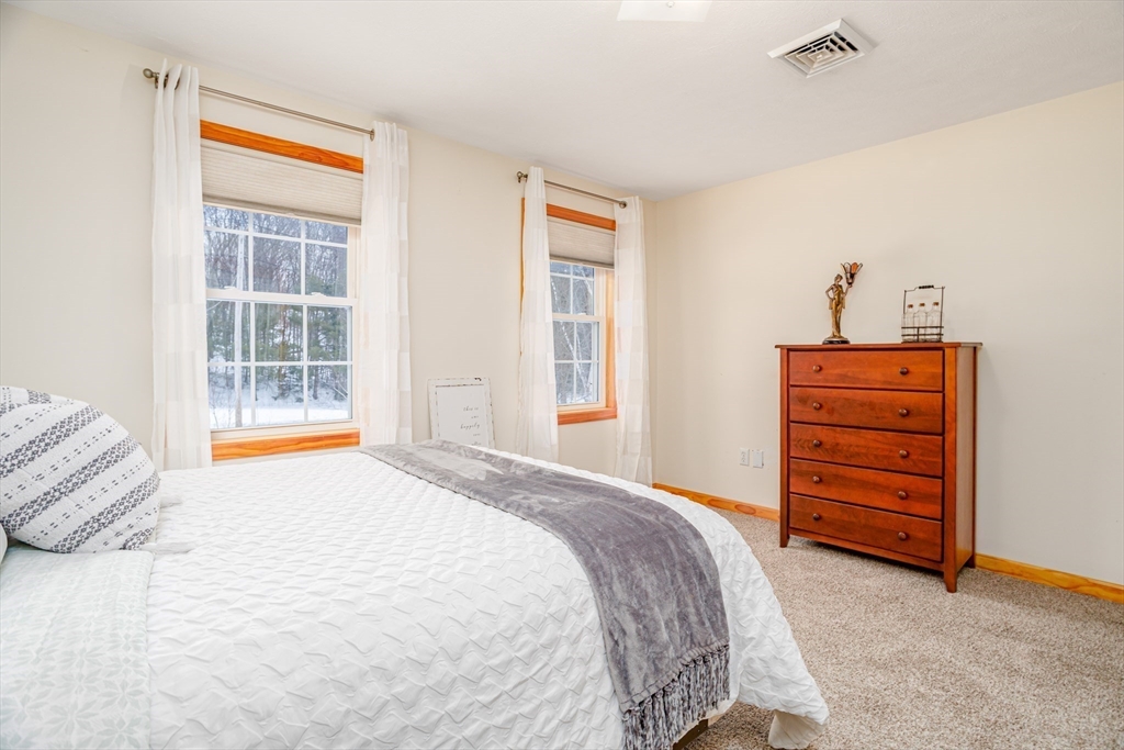 326 Matthews Street Gardner, MA 01440 - Photo 31 of 42 a bedroom with a bed and a window