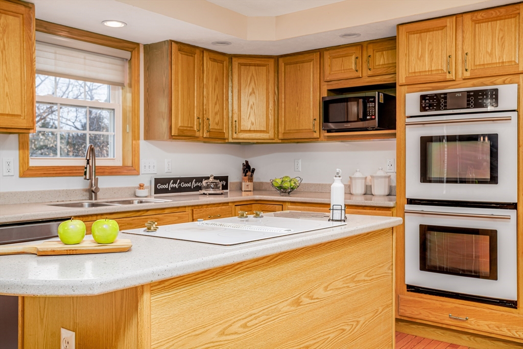 326 Matthews Street Gardner, MA 01440 - Photo 6 of 42 a kitchen with stainless steel appliances granite countertop a stove a sink and a microwave