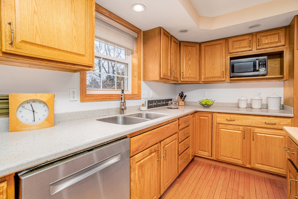 326 Matthews Street Gardner, MA 01440 - Photo 7 of 42 a kitchen with stainless steel appliances granite countertop wooden cabinets a sink and a stove