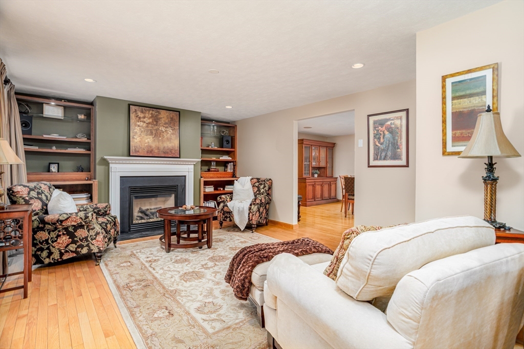 326 Matthews Street Gardner, MA 01440 - Photo 10 of 42 a bed room with furniture and a fireplace