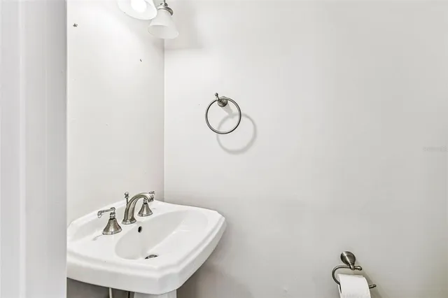 a bathroom with a sink and mirror