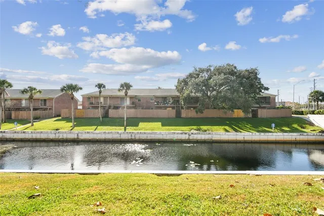 a view of a swimming pool and a yard