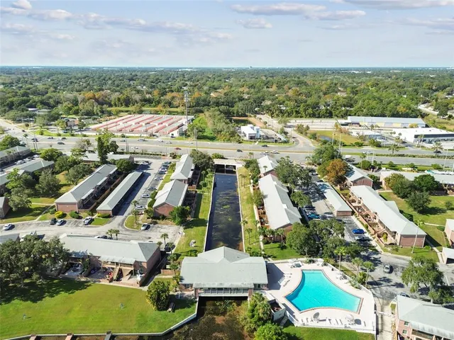 an aerial view of residential houses and outdoor space
