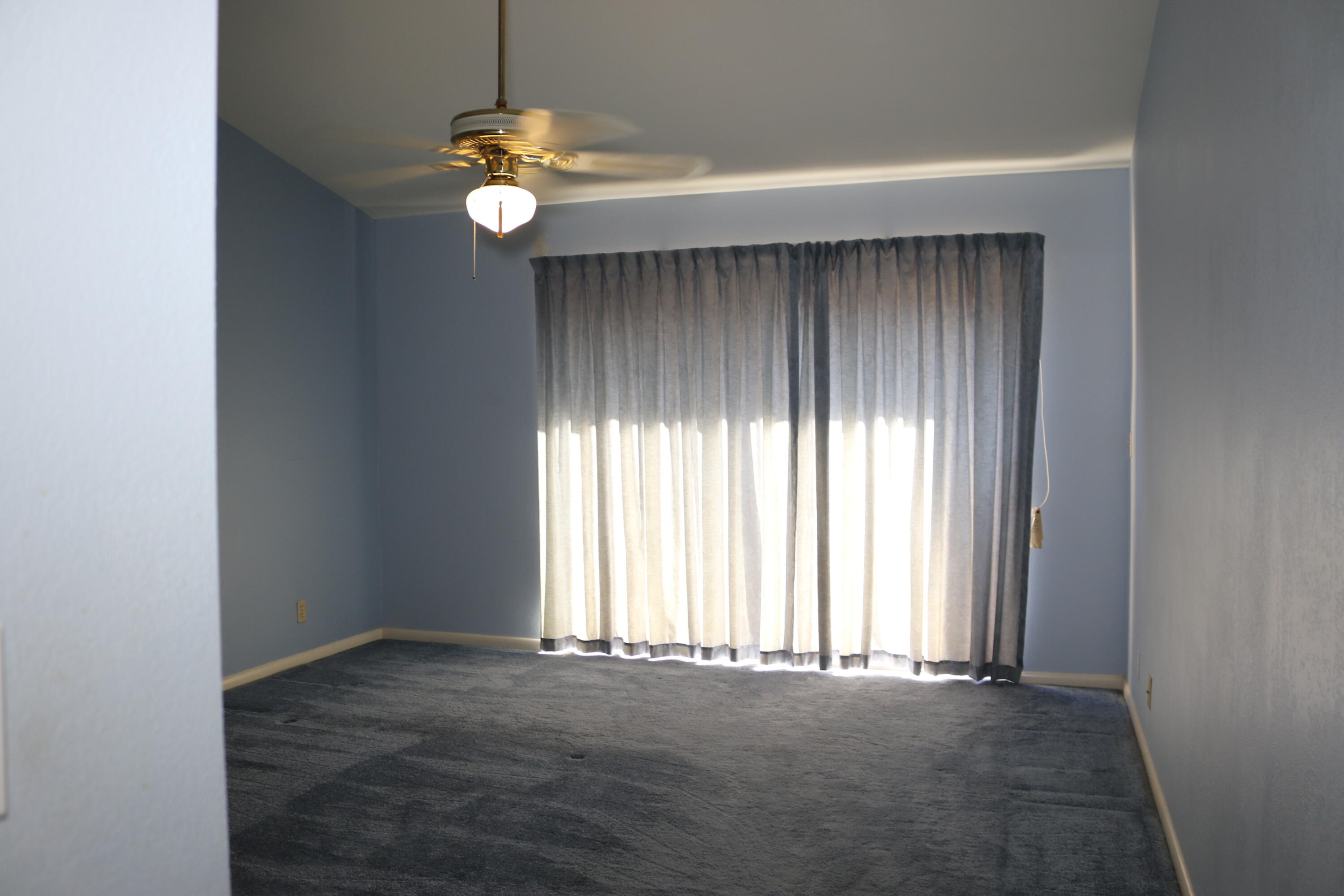 403 Springdale Circle Palm Springs, FL 33461 - Photo 30 of 45 a view of an empty room with window and bathroom