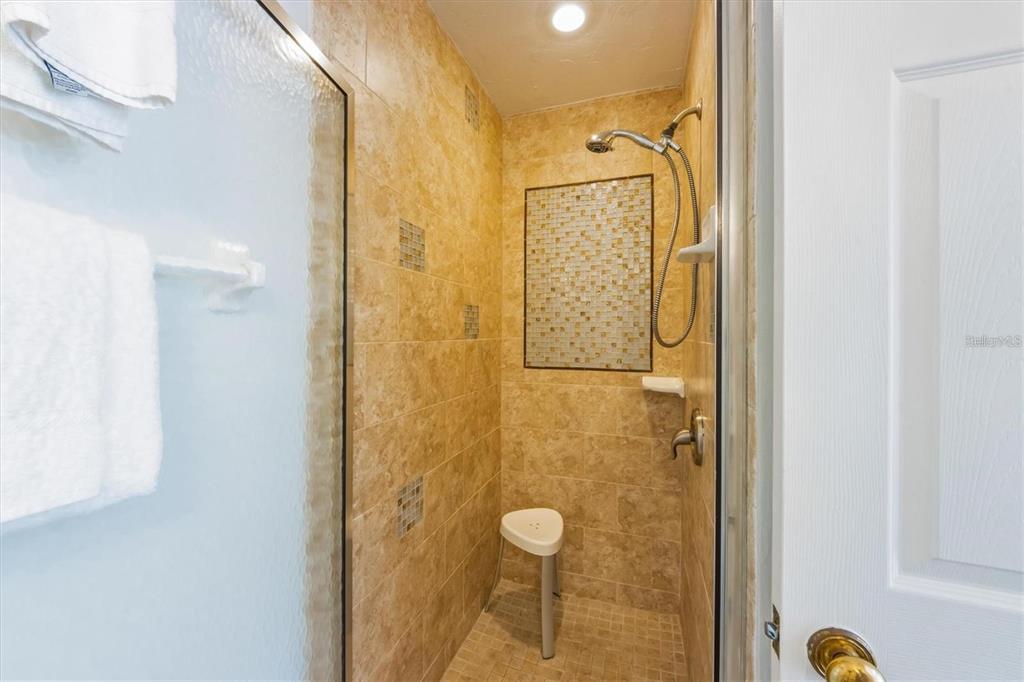 110 Oak Avenue, Unit A Anna Maria, FL 34216 - Photo 19 of 30 a bathroom with a shower
