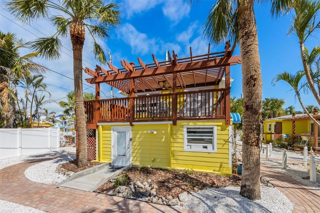 110 Oak Avenue, Unit A Anna Maria, FL 34216 - Photo 3 of 30 a front view of a house