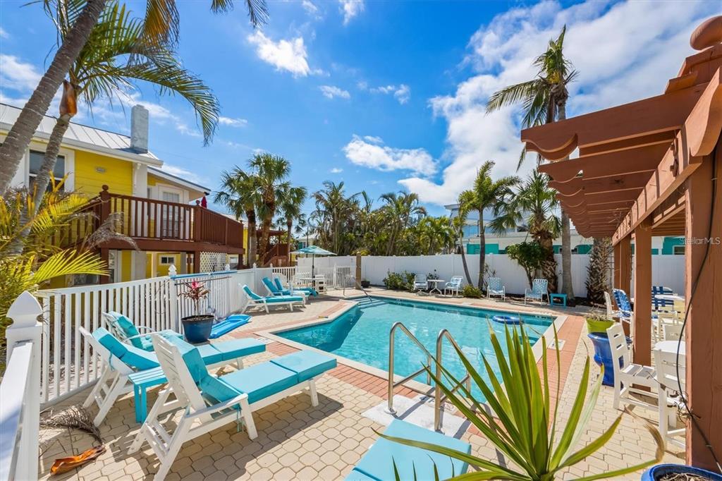 110 Oak Avenue, Unit A Anna Maria, FL 34216 - Photo 8 of 30 a view of a swimming pool with a patio