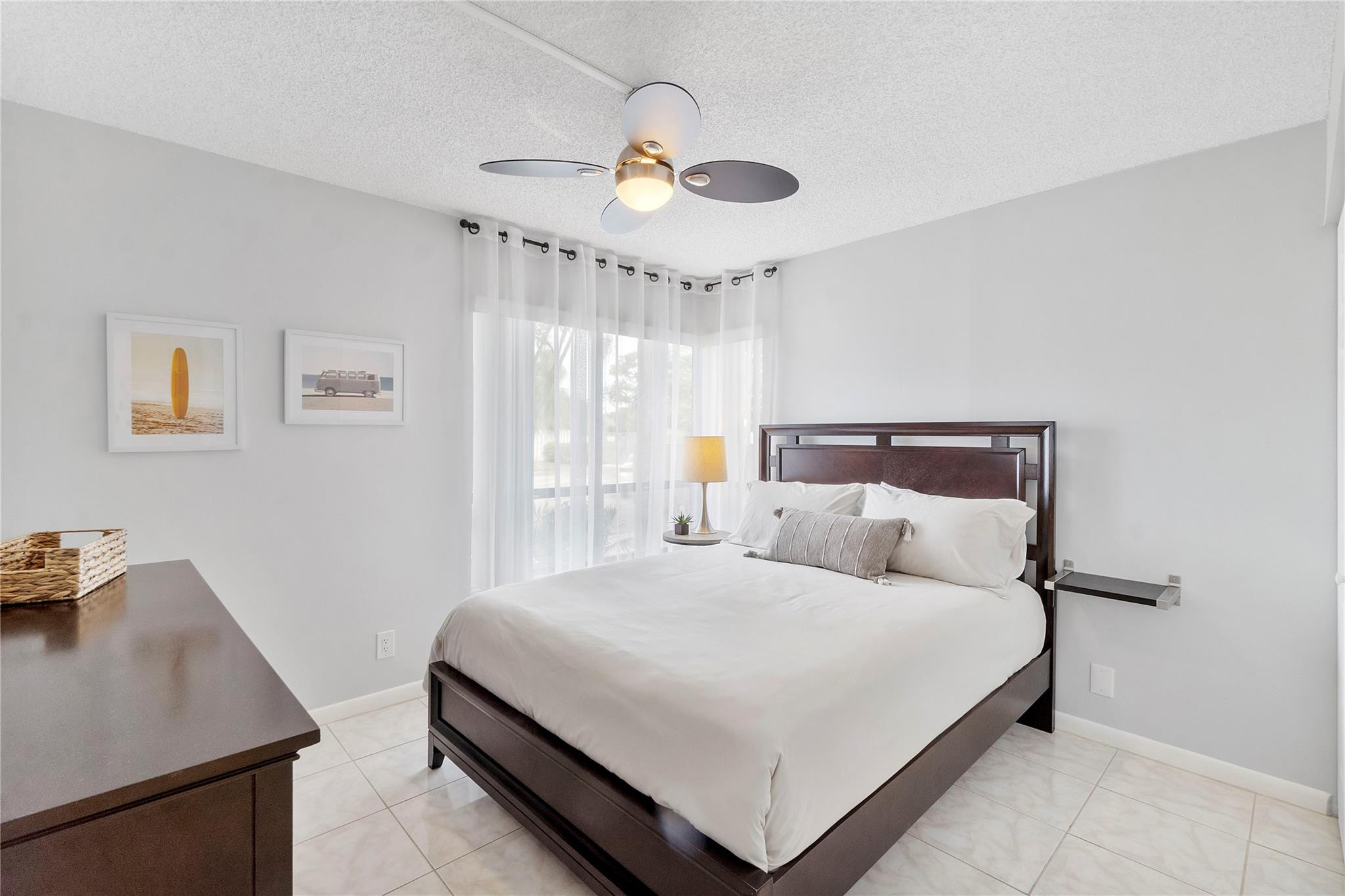 2289 Southwest 15th Street, Unit 129 Deerfield Beach, FL 33442 - Photo 14 of 41 a bedroom with a bed and a desk