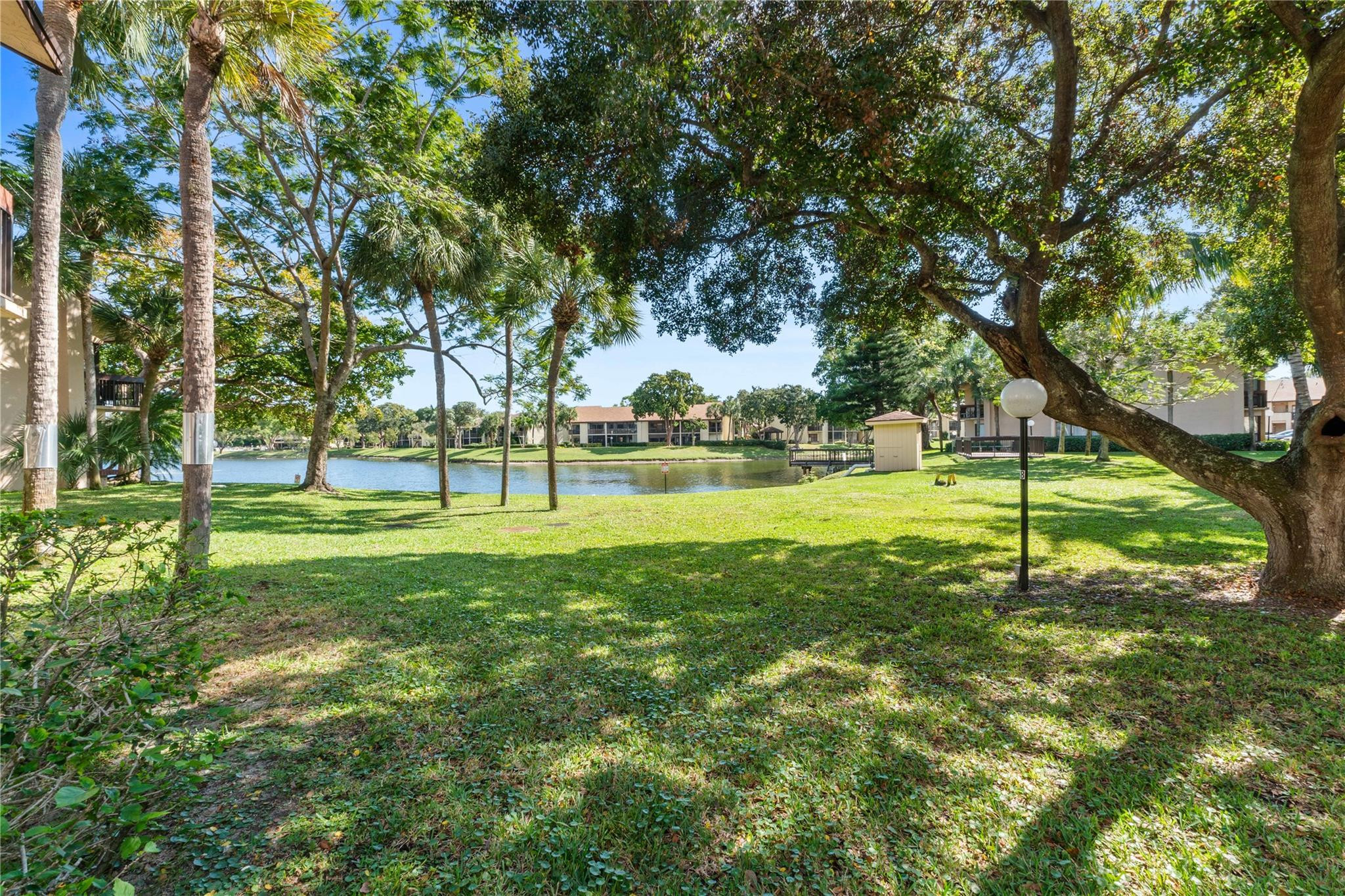 2289 Southwest 15th Street, Unit 129 Deerfield Beach, FL 33442 - Photo 2 of 41 a view of a park with large trees