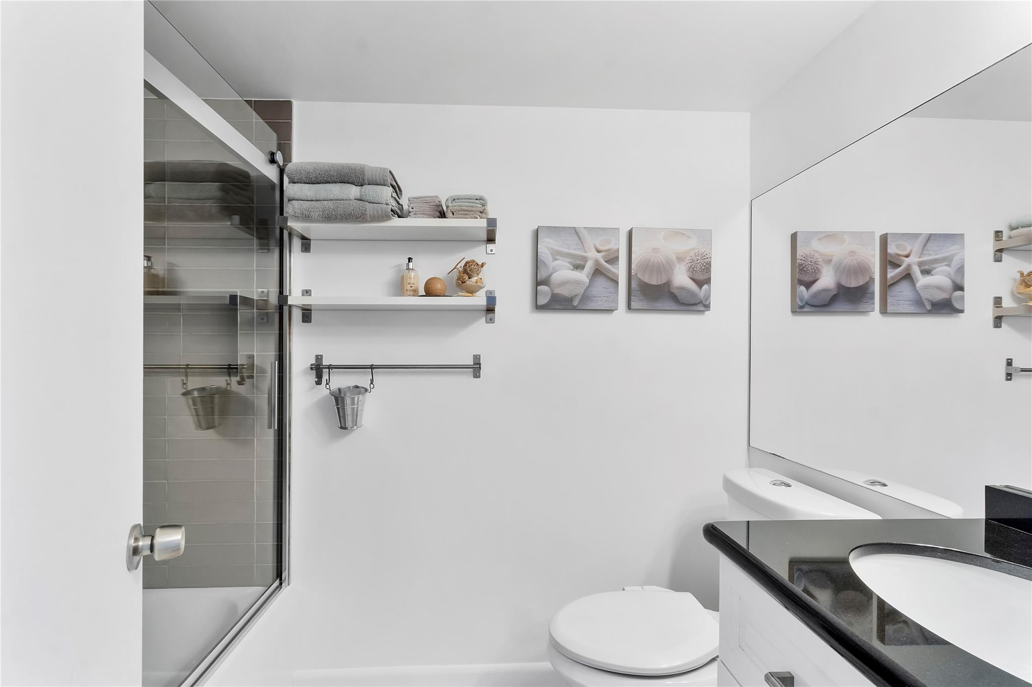 2289 Southwest 15th Street, Unit 129 Deerfield Beach, FL 33442 - Photo 24 of 41 a bathroom with a sink toilet and vanity