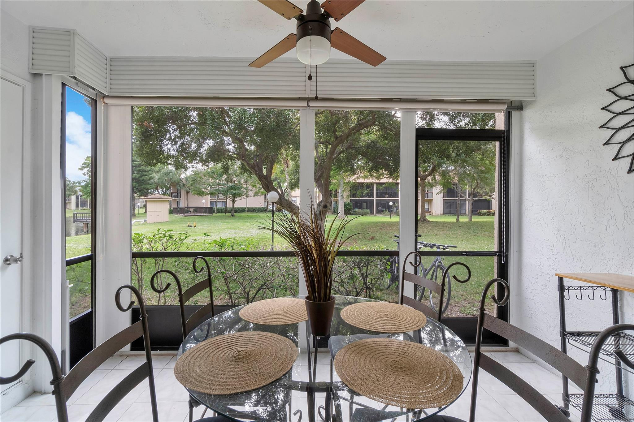 2289 Southwest 15th Street, Unit 129 Deerfield Beach, FL 33442 - Photo 28 of 41 a view of a dining room with furniture window and outside view