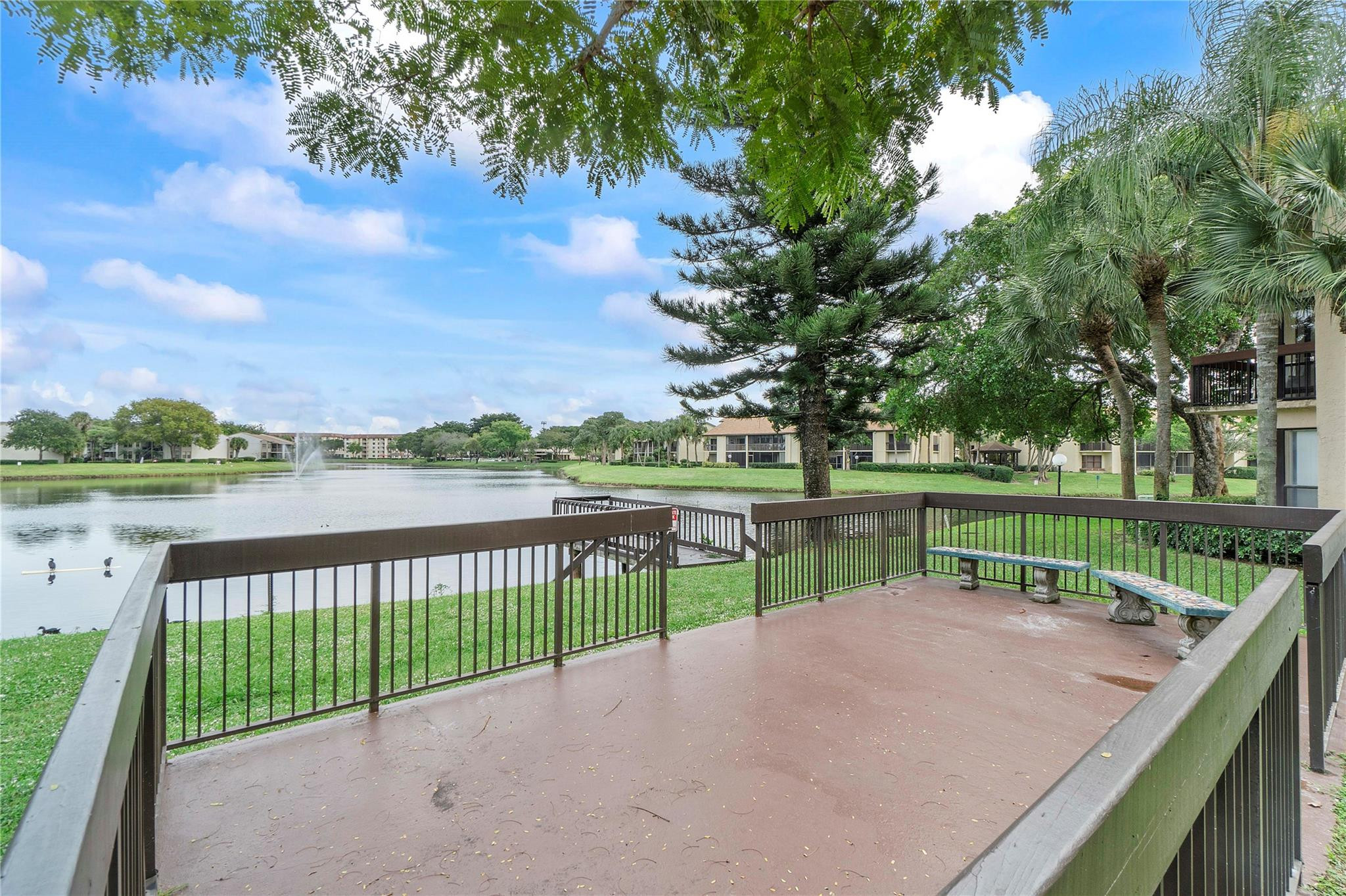 2289 Southwest 15th Street, Unit 129 Deerfield Beach, FL 33442 - Photo 35 of 41 a view of lake with a swimming pool