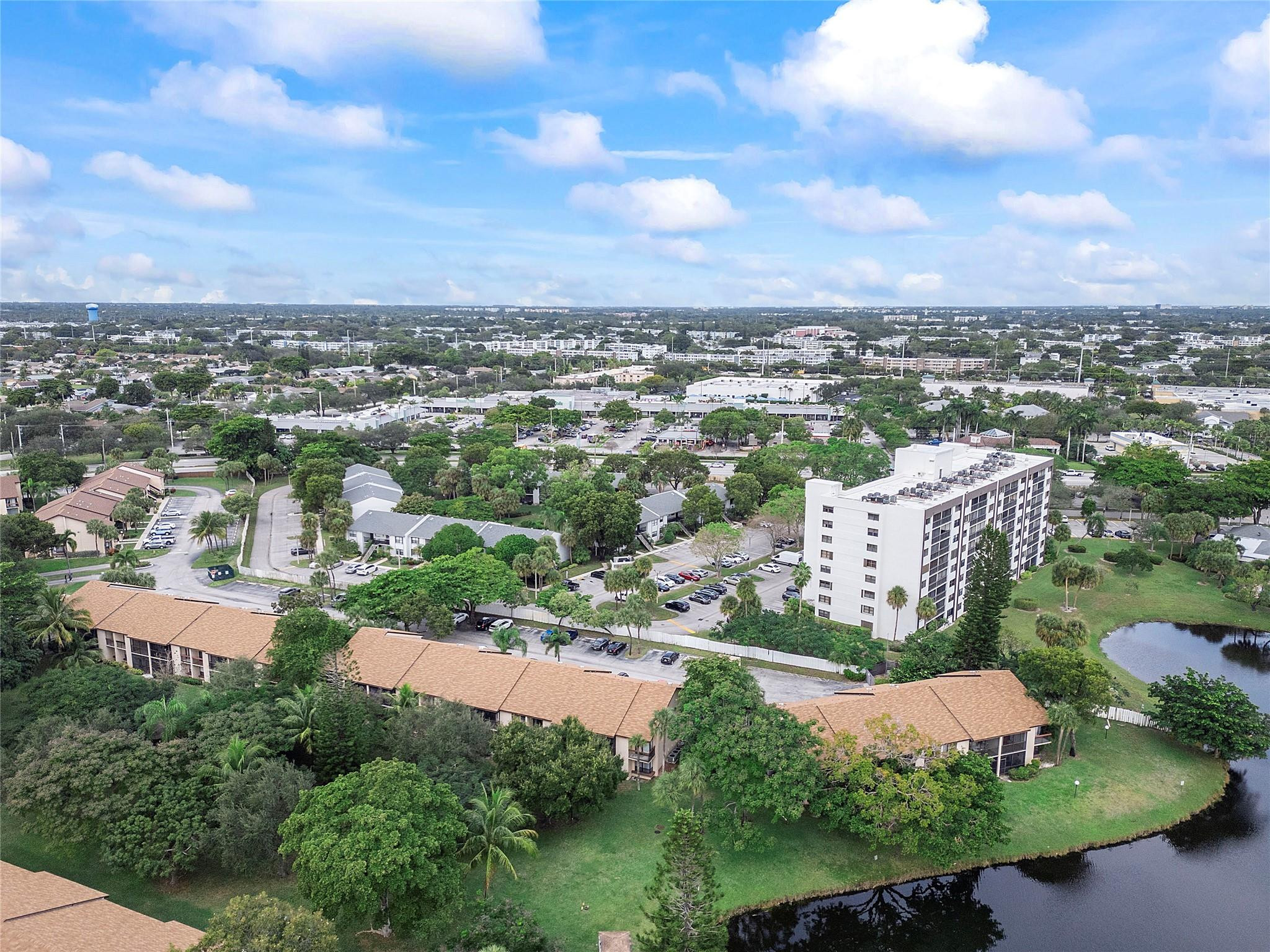 2289 Southwest 15th Street, Unit 129 Deerfield Beach, FL 33442 - Photo 38 of 41 an aerial view of residential houses with outdoor space and lake view in back