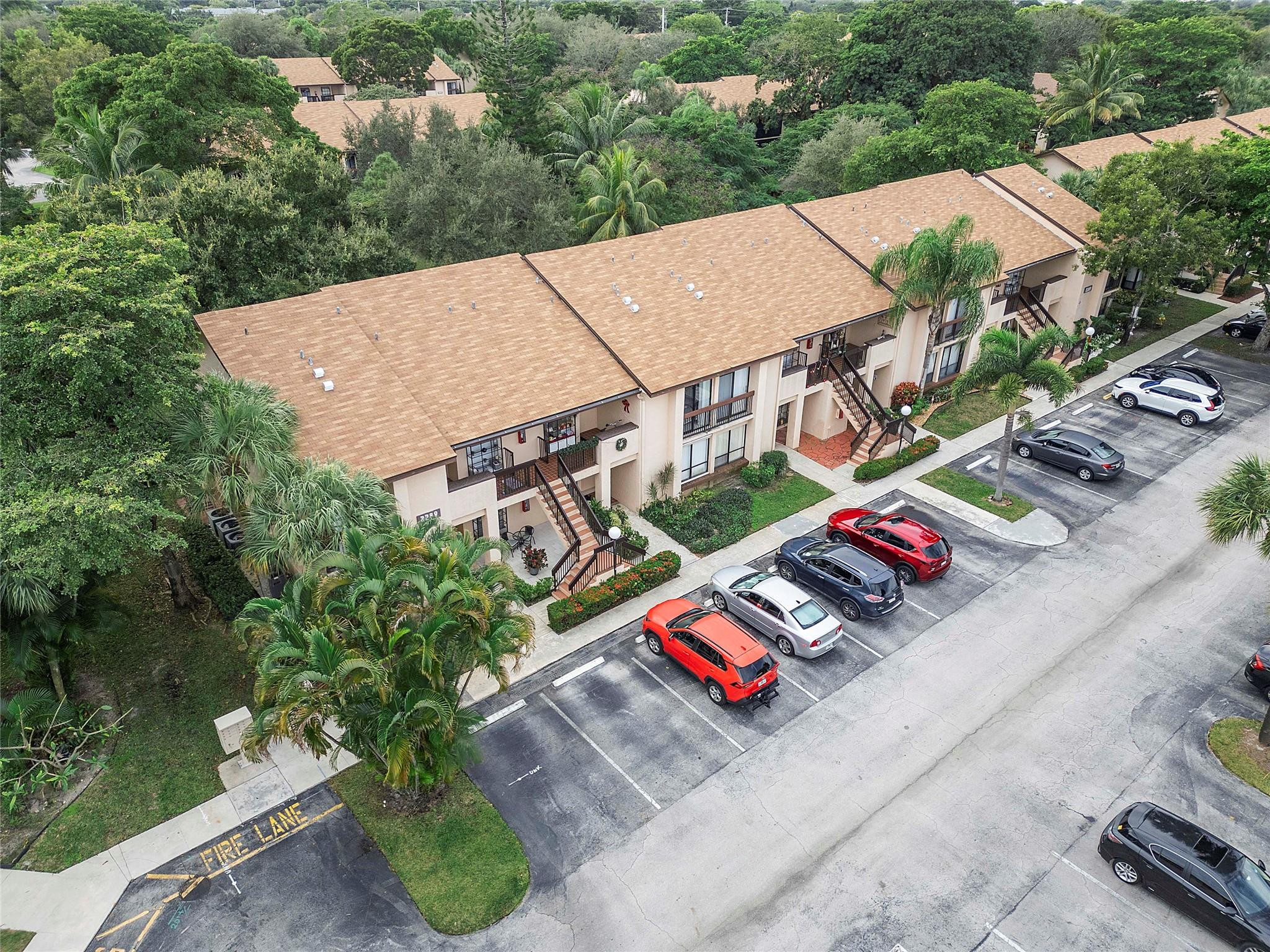 2289 Southwest 15th Street, Unit 129 Deerfield Beach, FL 33442 - Photo 41 of 41 an aerial view of a house roof deck and outdoor seating
