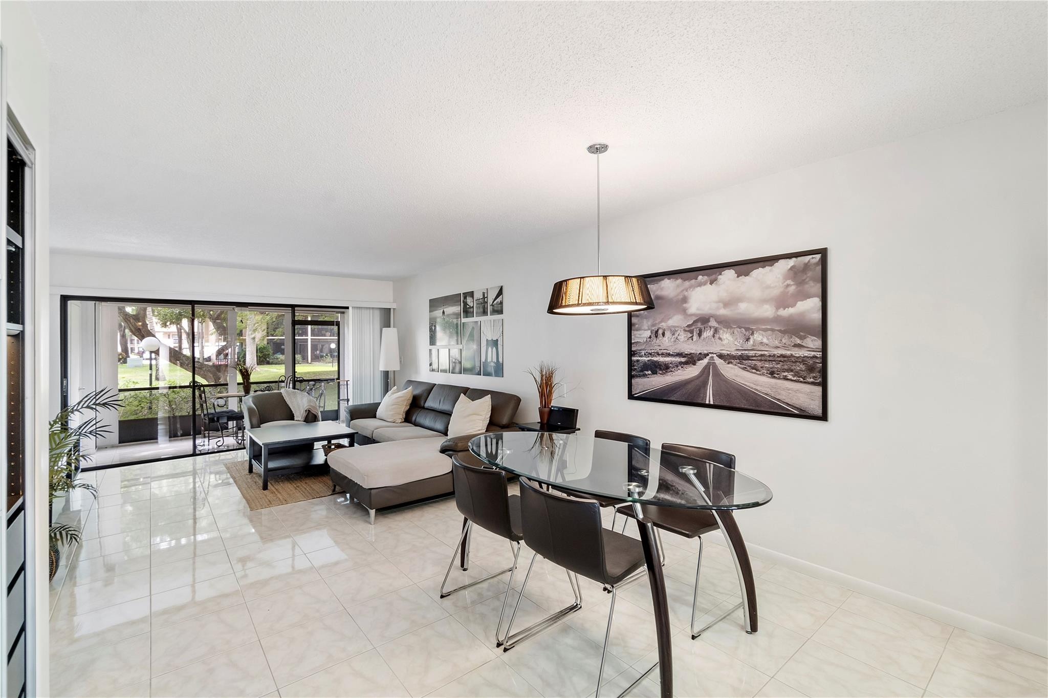 2289 Southwest 15th Street, Unit 129 Deerfield Beach, FL 33442 - Photo 7 of 41 a living room with furniture and a large window