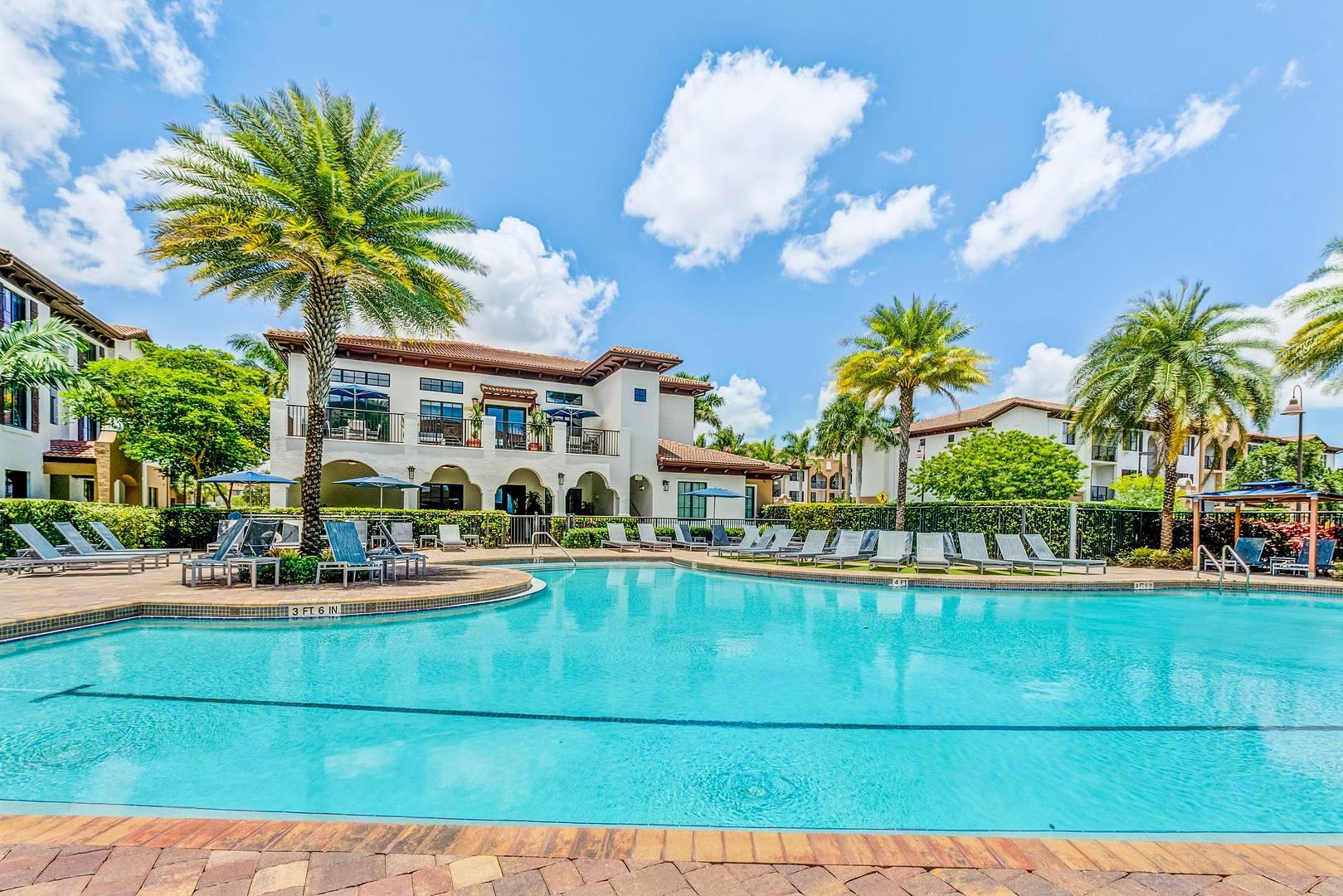 16816 Southwest 137th Avenue, Unit 1243 Miami, FL 33177 - Photo 1 of 14 a view of a house with outdoor space and swimming pool