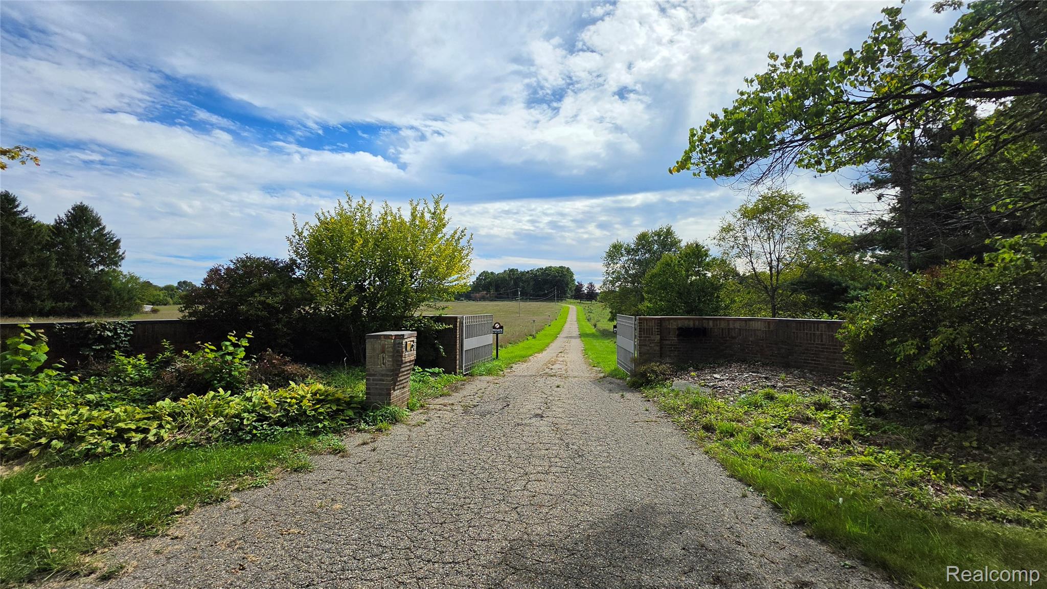 2551 Patterson Lk Road Pinckney, MI 48169 - Photo 2 of 37 Gated paved entry