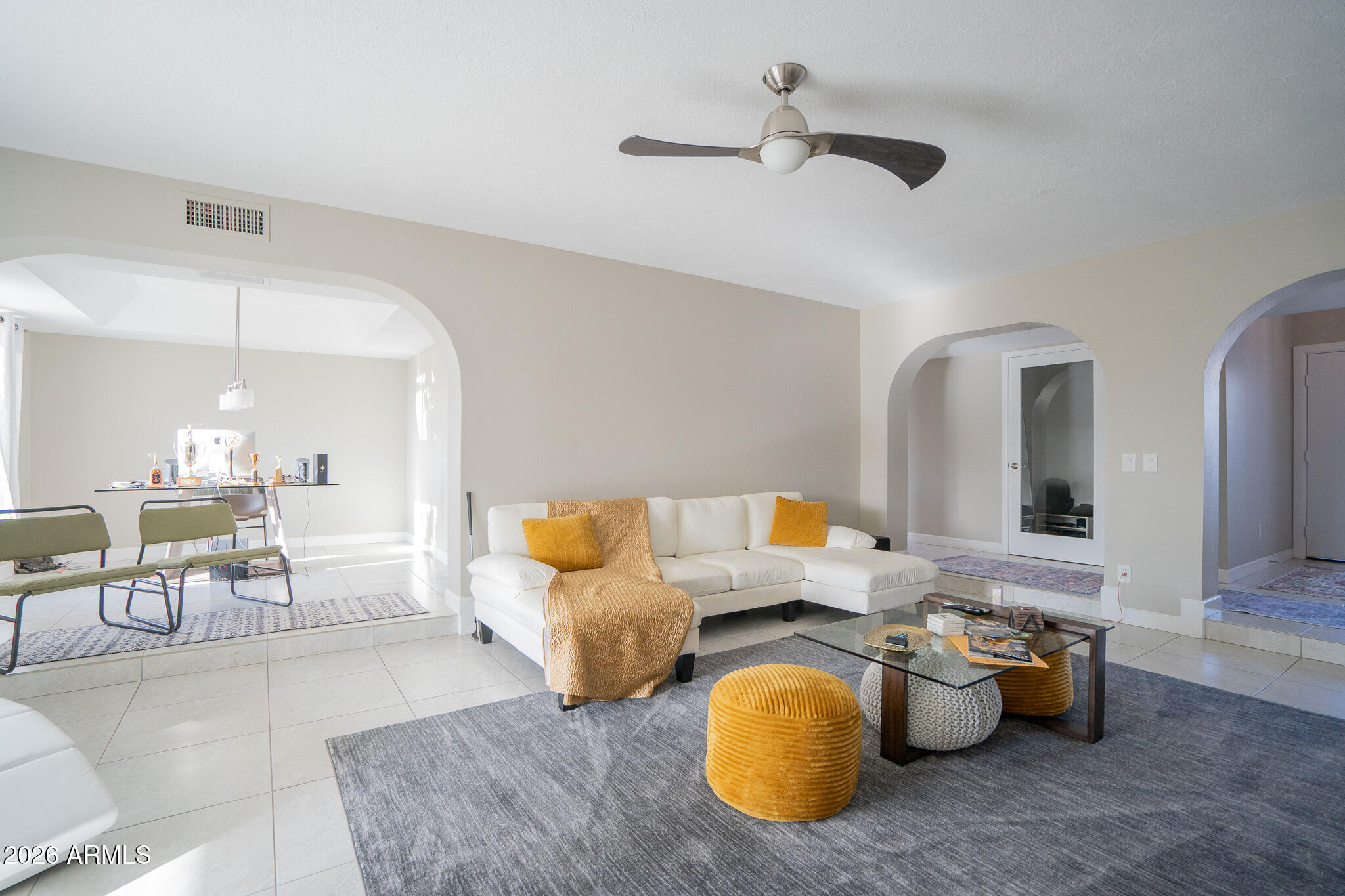 1201 East Rowlands Lane Phoenix, AZ 85022 - Photo 15 of 40 a living room with furniture and a chandelier