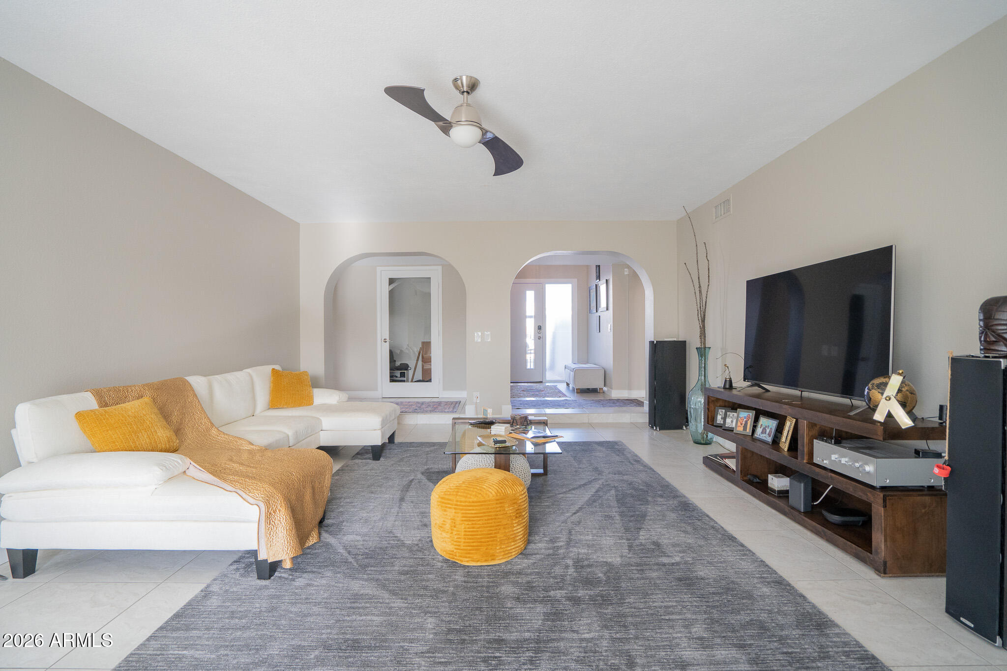 1201 East Rowlands Lane Phoenix, AZ 85022 - Photo 16 of 40 a living room with furniture and a flat screen tv