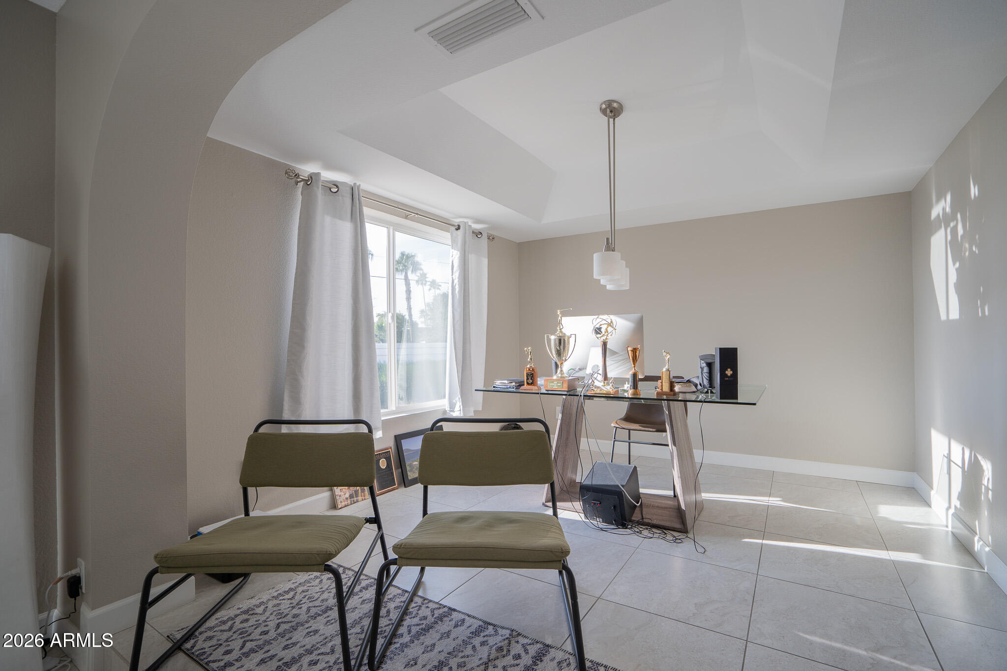 1201 East Rowlands Lane Phoenix, AZ 85022 - Photo 17 of 40 a living room with furniture and a window