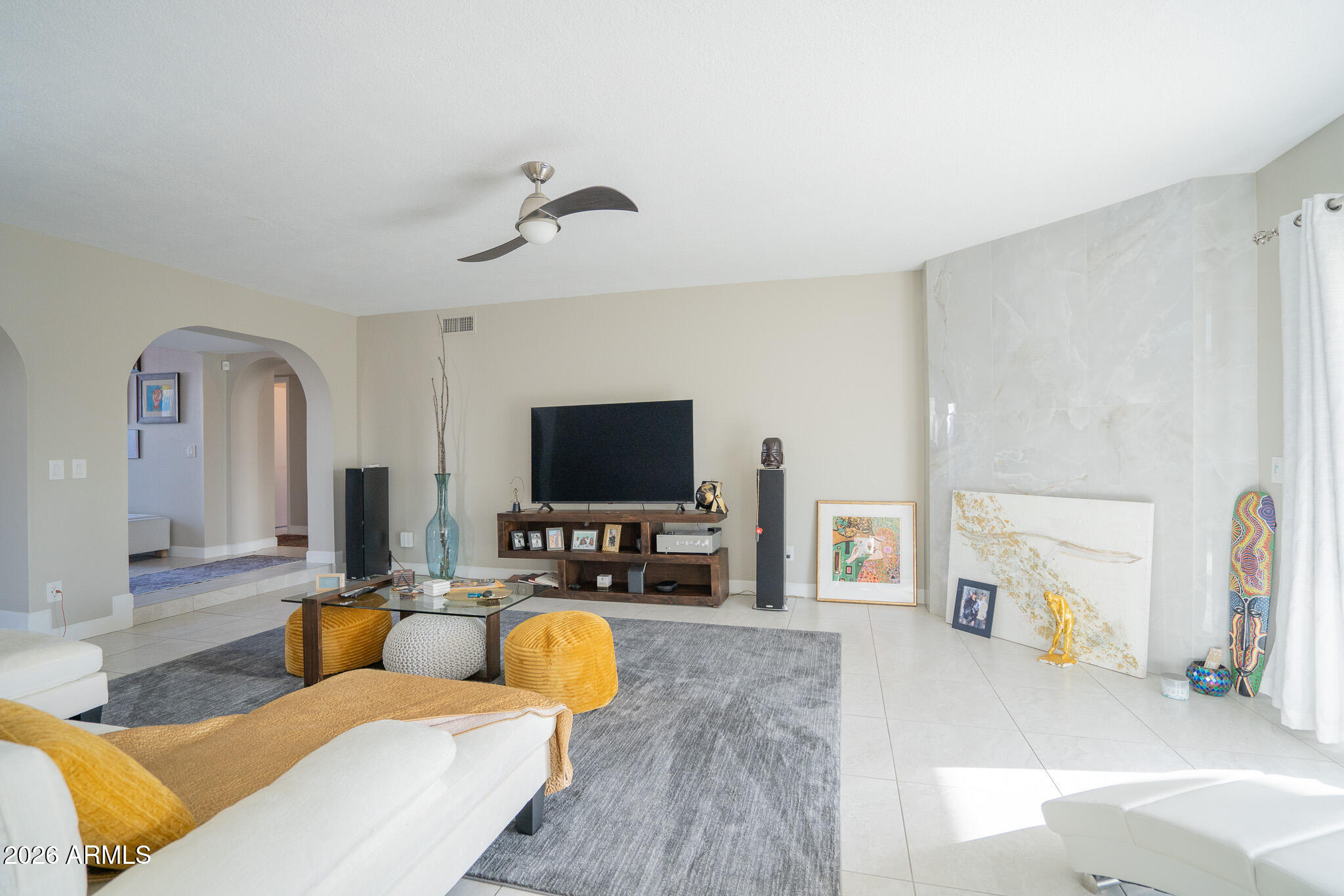 1201 East Rowlands Lane Phoenix, AZ 85022 - Photo 18 of 40 a living room with furniture and a flat screen tv