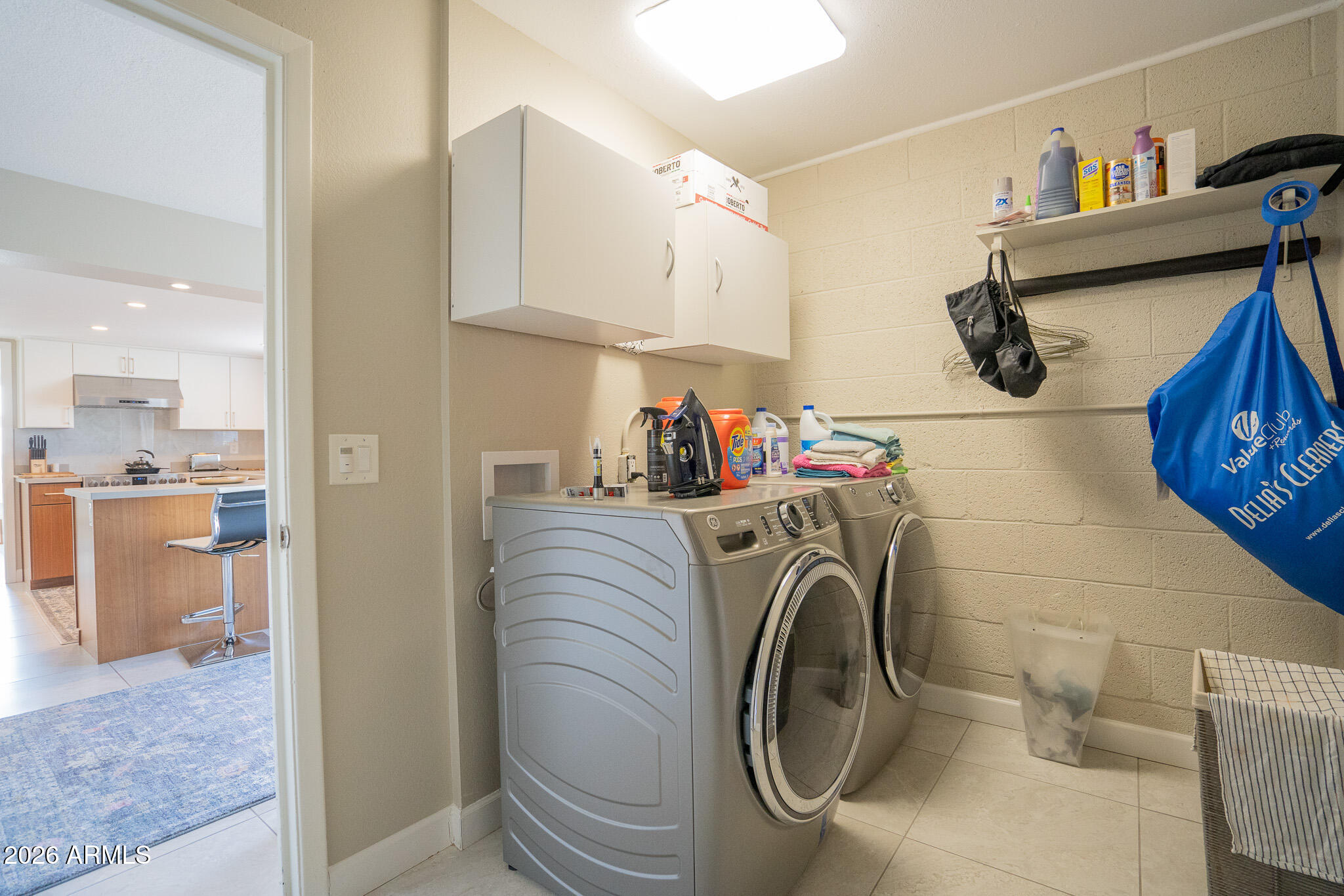 1201 East Rowlands Lane Phoenix, AZ 85022 - Photo 24 of 40 a utility room with sink dryer and washer