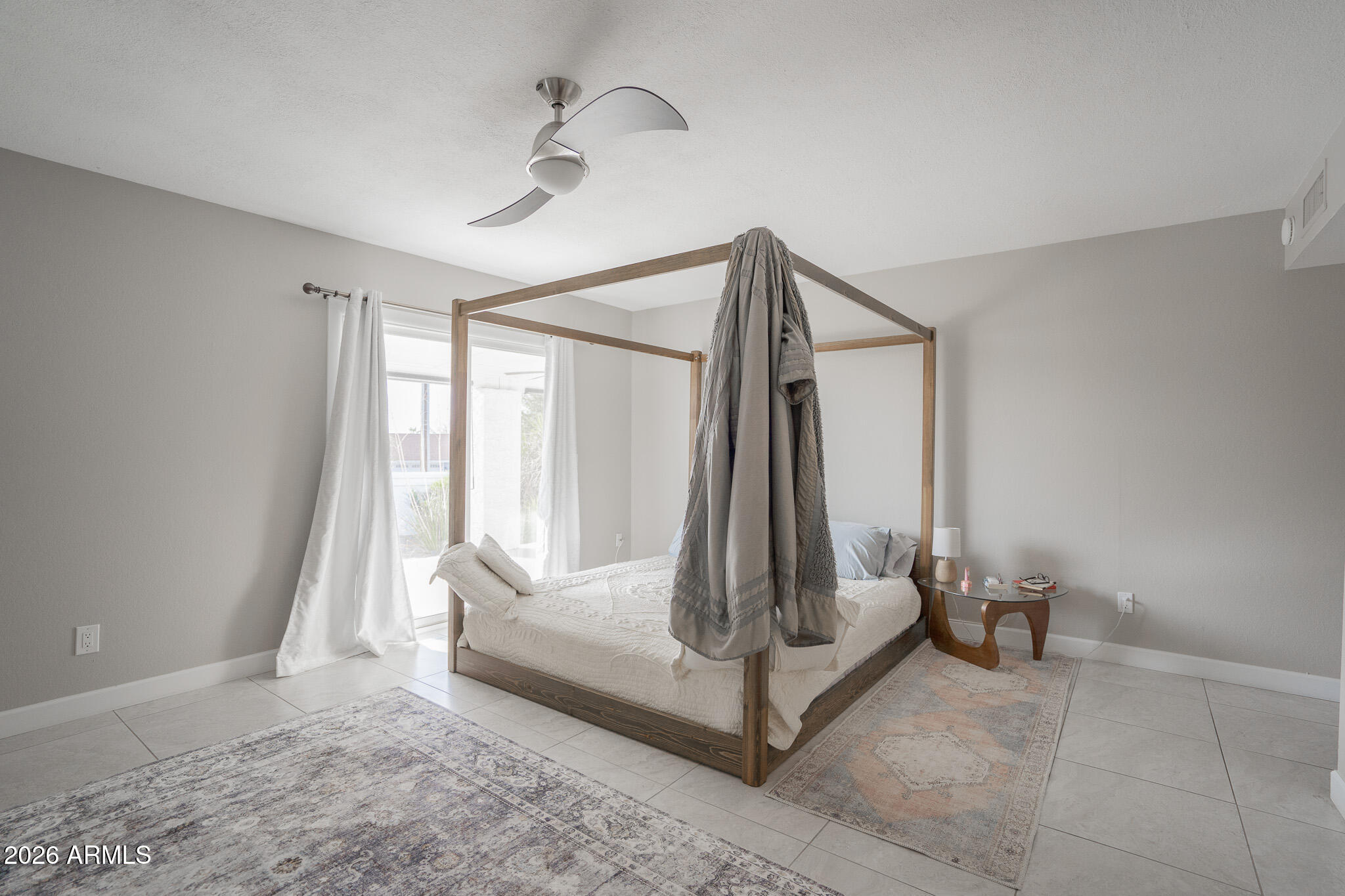 1201 East Rowlands Lane Phoenix, AZ 85022 - Photo 28 of 40 a view of a room with a flat screen tv and a bathtub