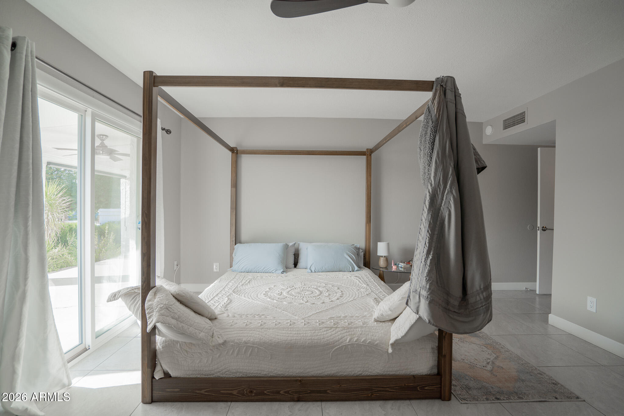 1201 East Rowlands Lane Phoenix, AZ 85022 - Photo 29 of 40 a bedroom with a bed and a window