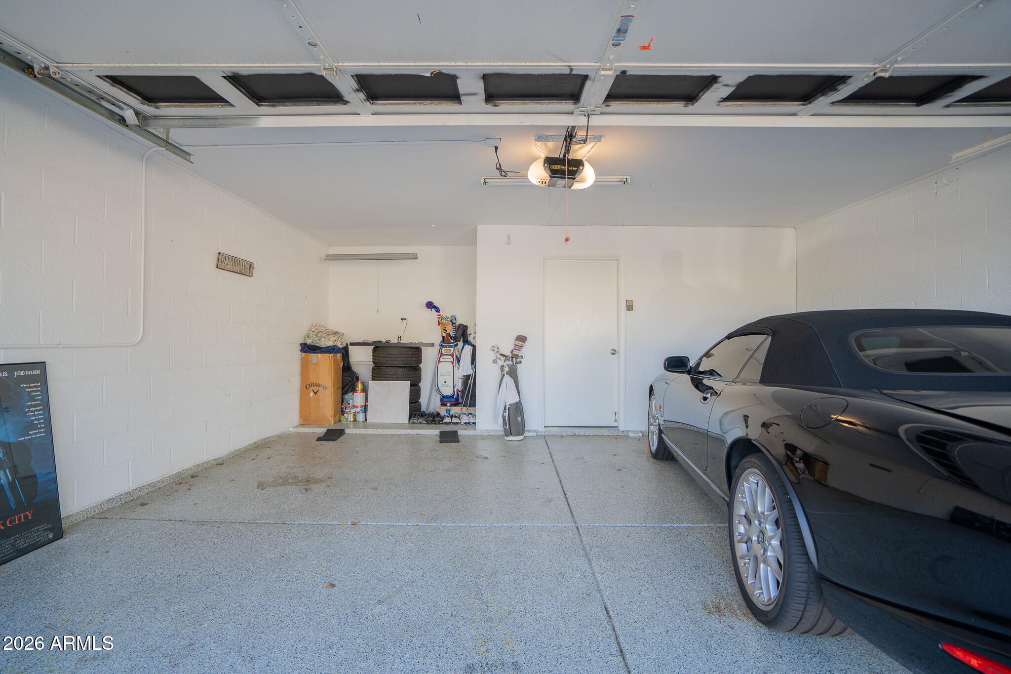 1201 East Rowlands Lane Phoenix, AZ 85022 - Photo 33 of 40 a utility room with multiple cars and other racks