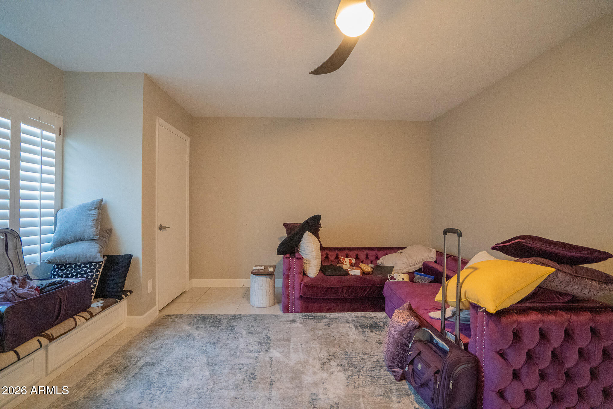 1201 East Rowlands Lane Phoenix, AZ 85022 - Photo 8 of 40 a bed room with a bed and a chair