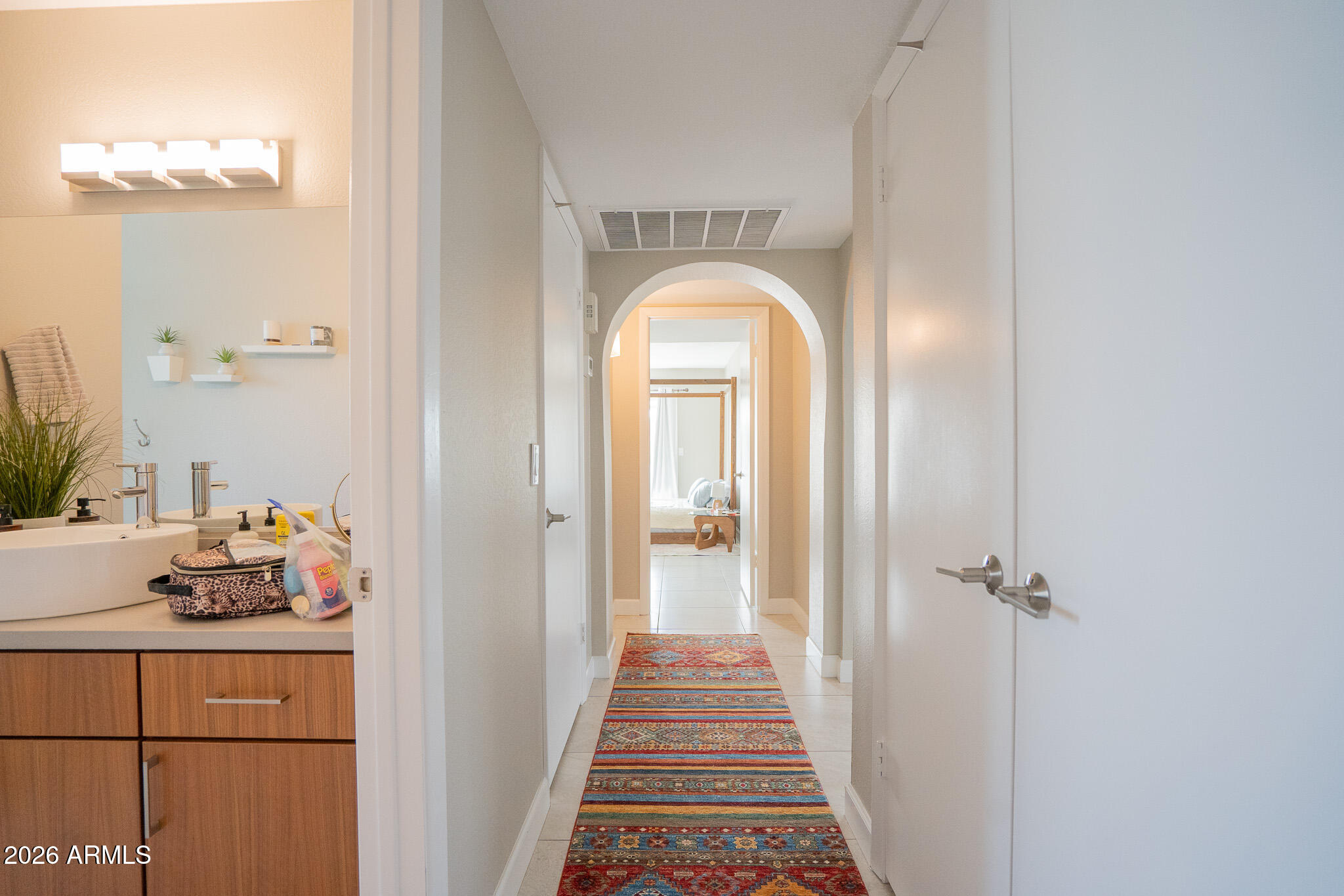 1201 East Rowlands Lane Phoenix, AZ 85022 - Photo 9 of 40 a hallway with a view of bedroom with wooden floor
