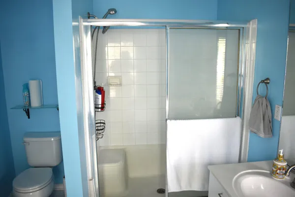 a bathroom with a sink toilet and shower