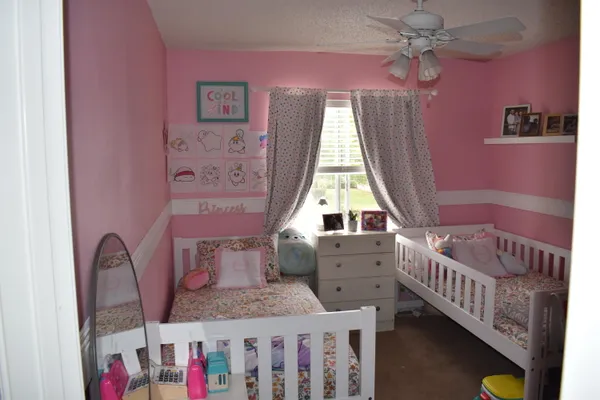 a bedroom with furniture and windows