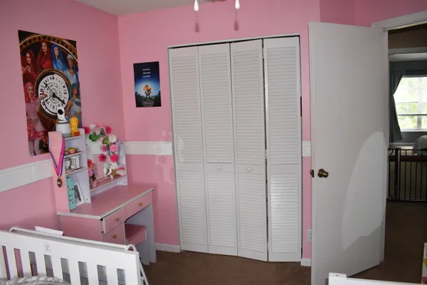 a bathroom with a sink a toilet and vanity