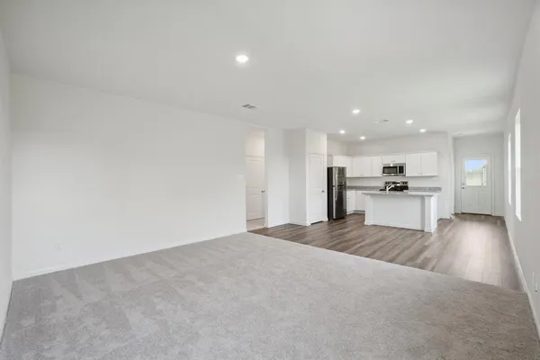 a view of kitchen with wooden floor