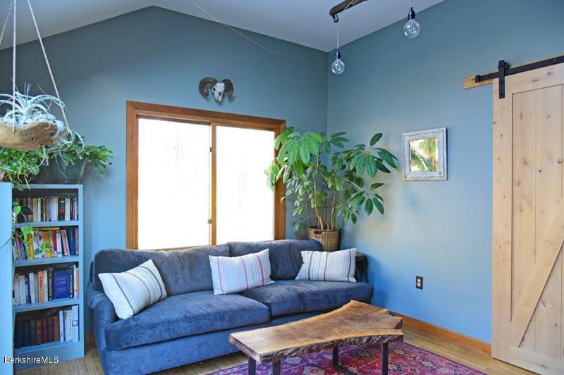 142 Polikoff Road Sheffield, MA 01222 - Photo 13 of 26 a living room with furniture and a window
