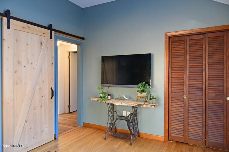 142 Polikoff Road Sheffield, MA 01222 - Photo 14 of 26 a workspace room with furniture and wooden floor