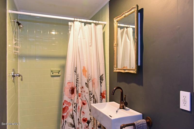 142 Polikoff Road Sheffield, MA 01222 - Photo 18 of 26 a bathroom with a granite countertop sink toilet and shower