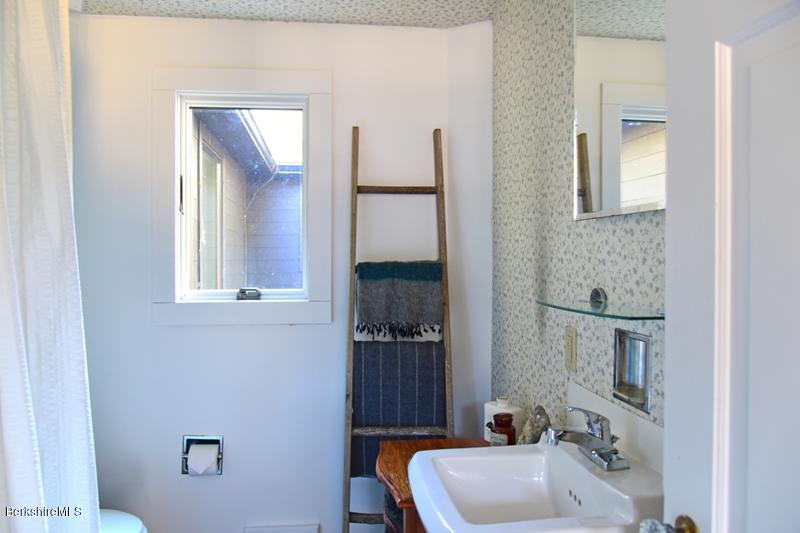 142 Polikoff Road Sheffield, MA 01222 - Photo 21 of 26 a bathroom with a sink and a mirror