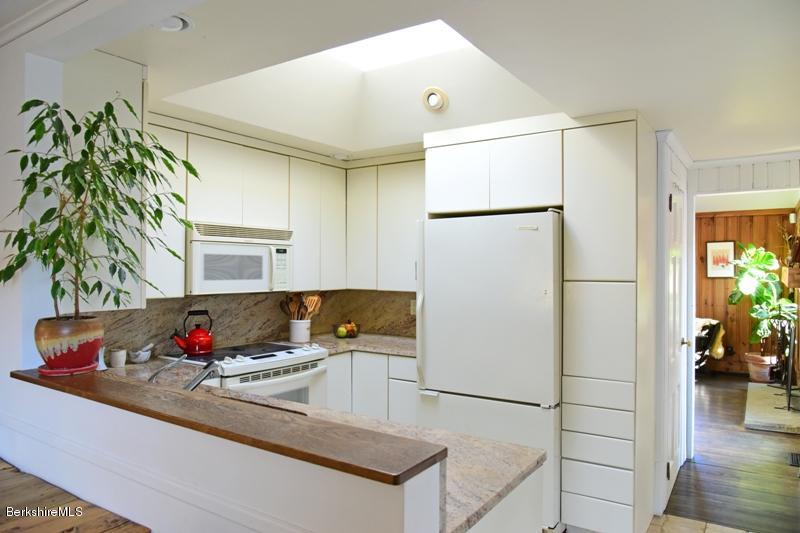 142 Polikoff Road Sheffield, MA 01222 - Photo 10 of 26 a kitchen with granite countertop a refrigerator and a sink