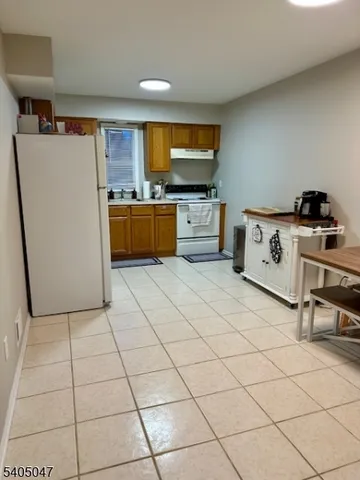 a kitchen with stainless steel appliances a stove a sink and a refrigerator