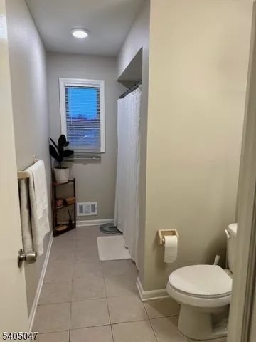 a bathroom with a toilet and a sink