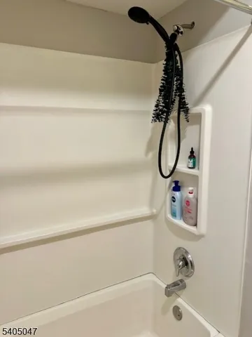 a bathroom with a bath tub