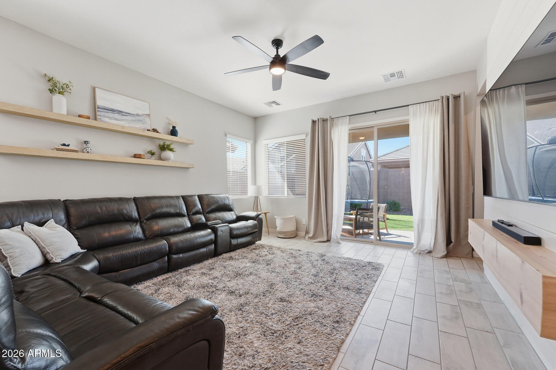 23069 East Mayberry Road Queen Creek, AZ 85142 - Photo 13 of 48 a living room with furniture and a chandelier