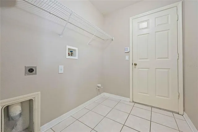 a kitchen with appliances a sink and cabinets